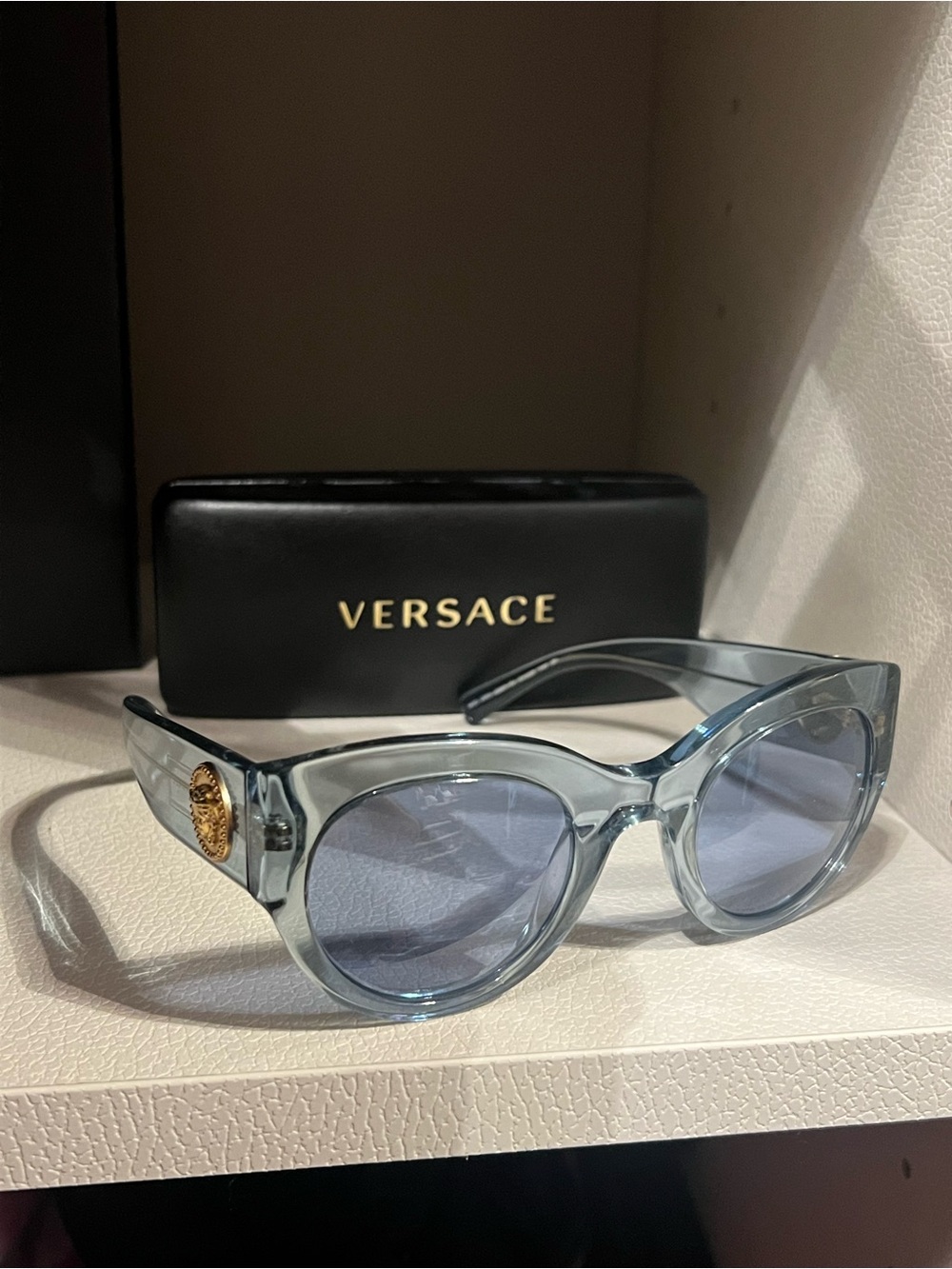 Versace Light Blue Transparent Frame Sunglasses with Gold Medusa Accent